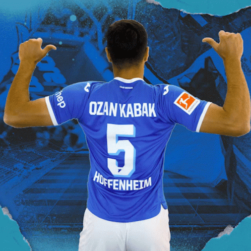 A Soccer Player Wearing A Blue Shirt With The Number 5 On It GIF