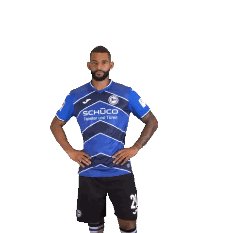 a soccer player wearing a blue shirt with the word schuco on it