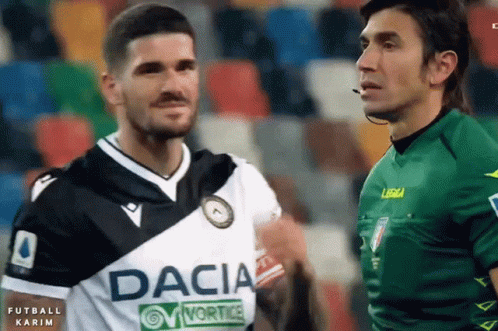 A Soccer Player Wearing A Dacia Jersey Stands Next To Another Player GIF