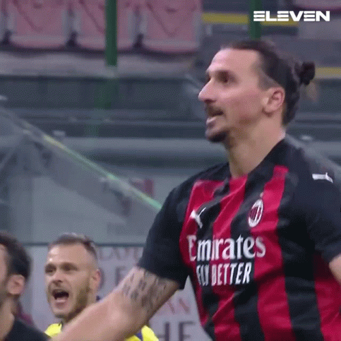 A Soccer Player Wearing A Emirates Fly Better Jersey Is Celebrating A Goal GIF