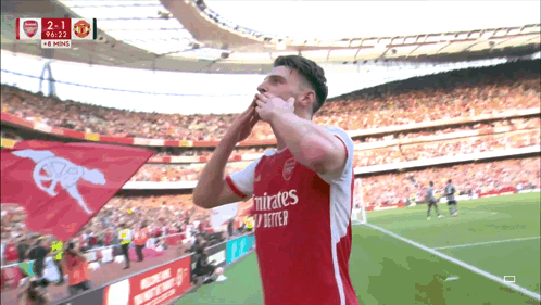 A Soccer Player Wearing A Emirates Jersey Celebrates A Goal GIF