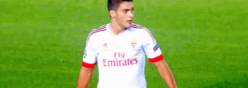 a soccer player wearing a fly emirates jersey