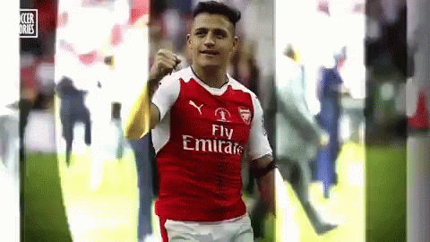 A Soccer Player Wearing A Fly Emirates Jersey Is Celebrating A Goal On The Field . GIF