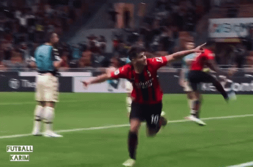 A Soccer Player Wearing A Fly Emirates Jersey Is Running On The Field GIF