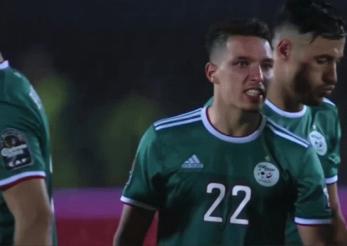 A Soccer Player Wearing A Green Adidas Jersey With The Number 22 On It GIF