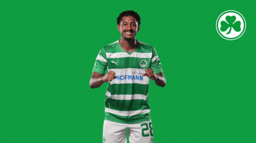 A Soccer Player Wearing A Green And White Jersey With The Number 20 GIF