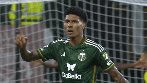 A Soccer Player Wearing A Green Dabella Jersey Celebrates GIF