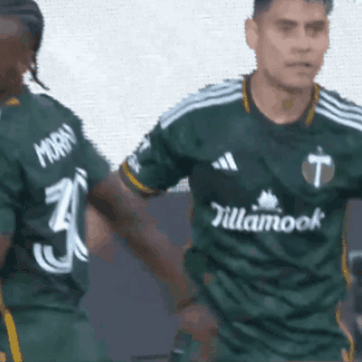 A Soccer Player Wearing A Green Jersey That Says Tillamook GIF