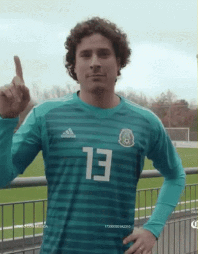 A Soccer Player Wearing A Green Jersey With The Number 13 On It GIF