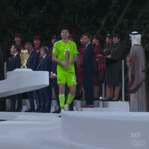A Soccer Player Wearing A Green Jersey With The Number 2 On It GIF