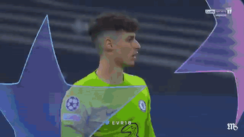 A Soccer Player Wearing A Green Jersey With The Word Evr18 On The Front GIF