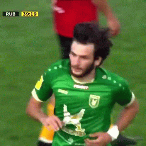 A Soccer Player Wearing A Green Shirt That Says David On It GIF