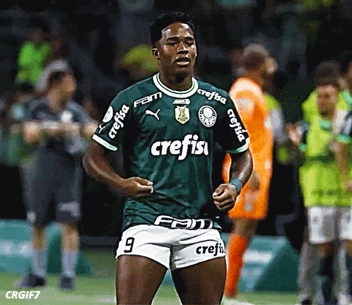 a soccer player wearing a green shirt with crefisa on the sleeves