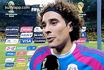 A Soccer Player Wearing A Headband Is Talking Into A Microphone GIF