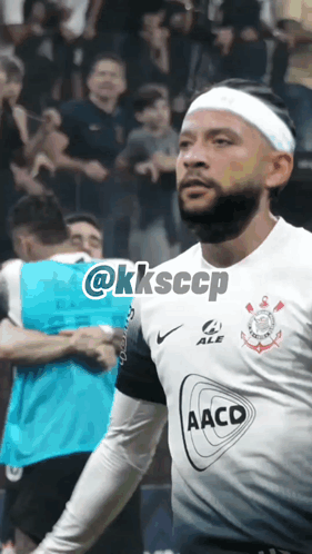 a soccer player wearing a headband with the word aacd on the front