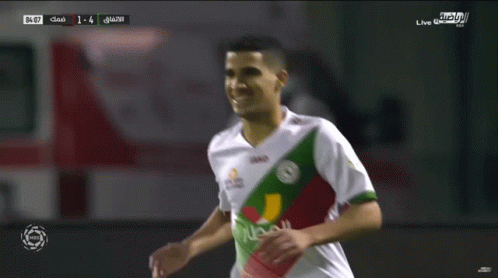 A Soccer Player Wearing A Jako Jersey Celebrates With Another Player GIF