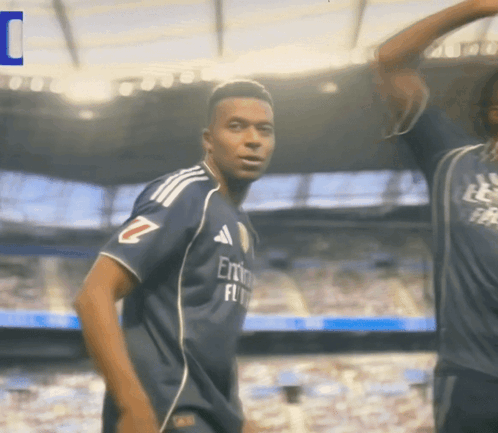 A Soccer Player Wearing A Jersey That Says Emirates Fly GIF