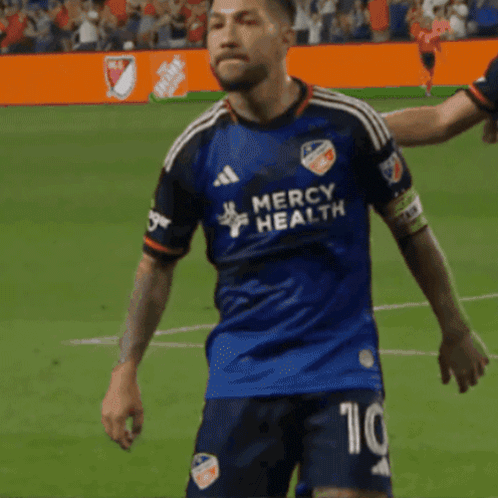 A Soccer Player Wearing A Jersey That Says Mercy Health On It GIF