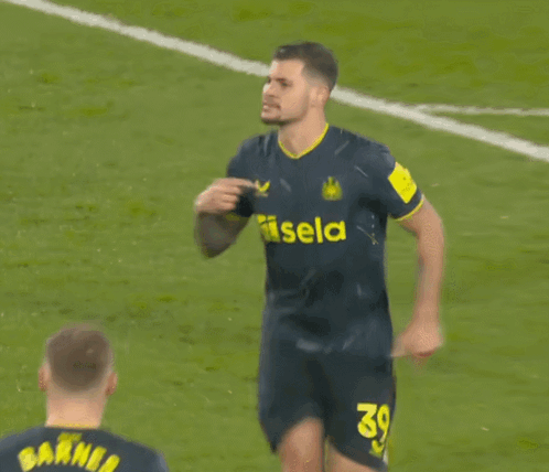 A Soccer Player Wearing A Jersey That Says Noon On The Arm GIF