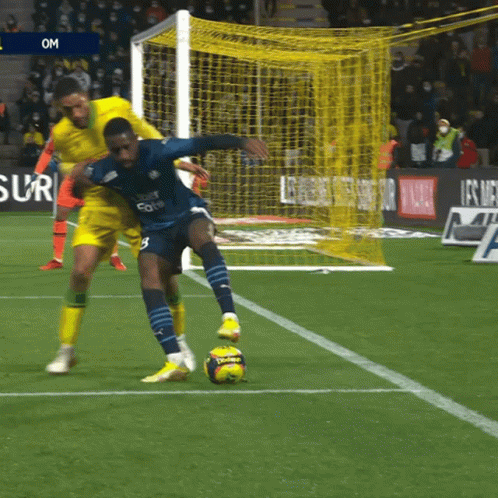 a soccer player wearing a jersey that says uber eats on it kicks the ball