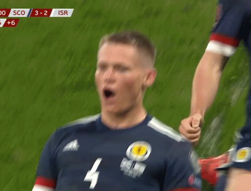 A Soccer Player Wearing A Jersey With The Number 4 GIF
