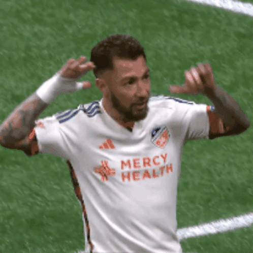 A Soccer Player Wearing A Mercy Health Jersey Celebrates A Goal GIF