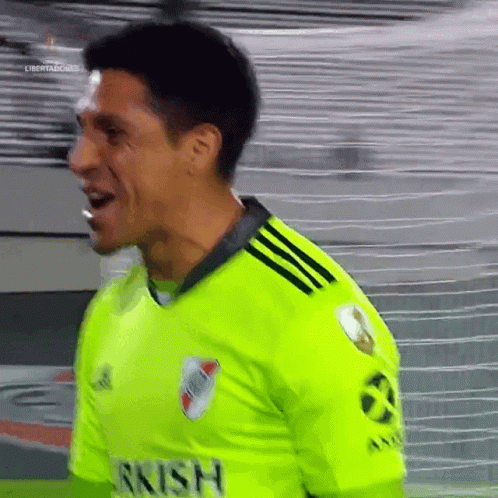 A Soccer Player Wearing A Neon Green Jersey That Says Rrish On It GIF
