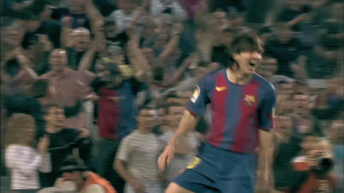 A Soccer Player Wearing A Nike Jersey Is Celebrating A Goal In Front Of A Crowd GIF