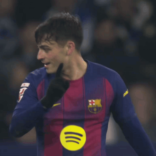 a soccer player wearing a nike jersey with a fcb logo