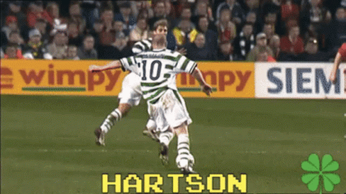 A Soccer Player Wearing A Number 10 Jersey Is Jumping In The Air GIF