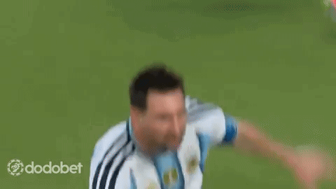 a soccer player wearing a number 10 jersey is kicking a soccer ball