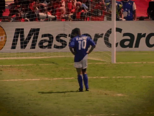 A Soccer Player Wearing A Number 10 Jersey Stands On The Field GIF