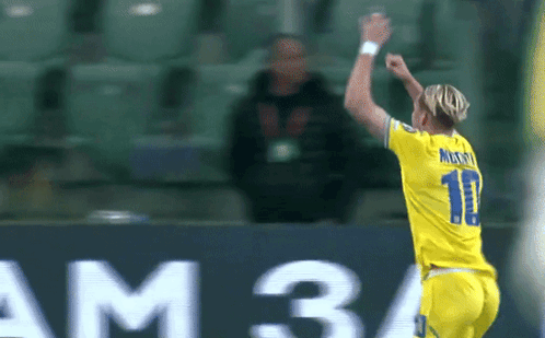 A Soccer Player Wearing A Number 11 Jersey Celebrates A Goal GIF