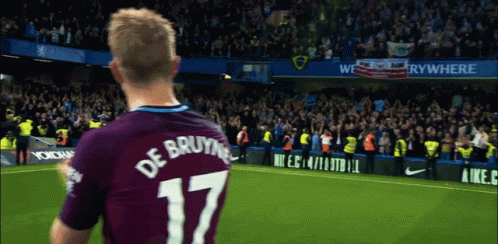 A Soccer Player Wearing A Number 17 Jersey Stands In Front Of A Crowd GIF