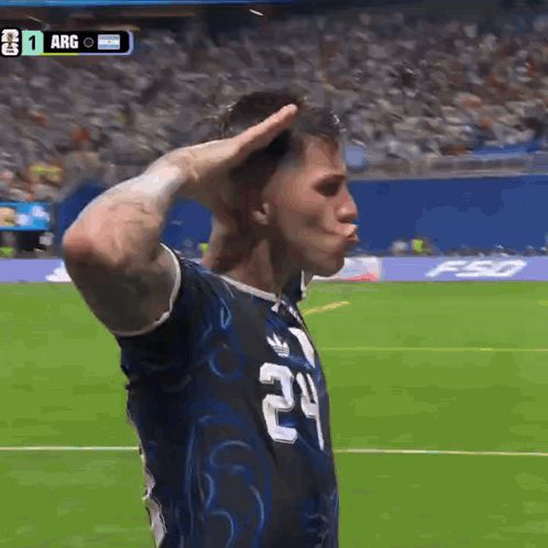 A Soccer Player Wearing A Number 24 Jersey Salutes The Crowd GIF