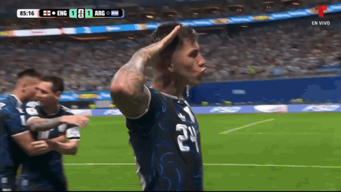 A Soccer Player Wearing A Number 24 Jersey Salutes The Crowd GIF