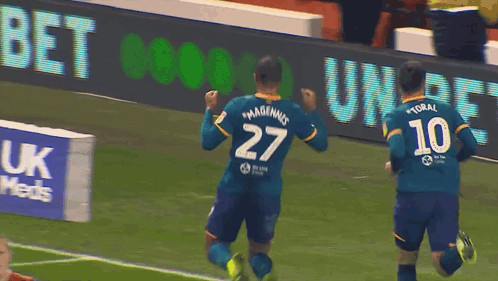A Soccer Player Wearing A Number 27 Jersey Celebrates A Goal GIF
