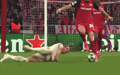 A Soccer Player Wearing A Number 34 Jersey Kicks The Ball GIF