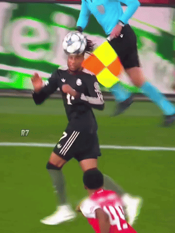 A Soccer Player Wearing A Number 40 Jersey Is Being Tackled By Another Player GIF