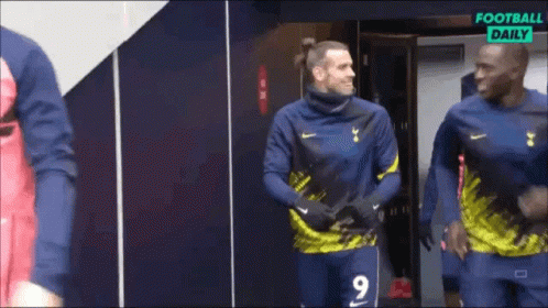 A Soccer Player Wearing A Number 9 Jersey Is Standing In A Locker Room GIF