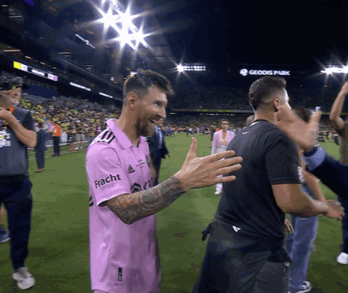 A Soccer Player Wearing A Pink Shirt That Says Fracht GIF