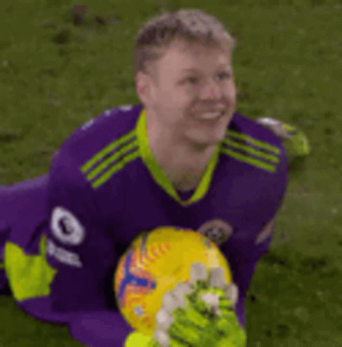 A Soccer Player Wearing A Purple Jersey With The Number 9 On The Sleeve GIF