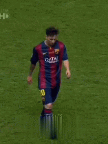 A Soccer Player Wearing A Qatar Airways Jersey Stands On The Field GIF