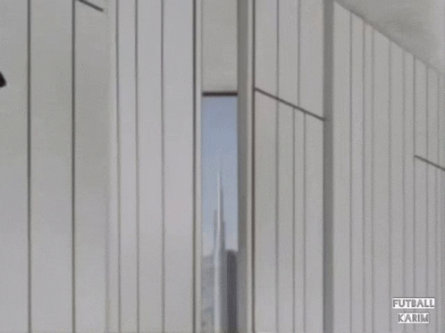 A Soccer Player Wearing A Red And Black Emirates Fly Bets Jersey GIF