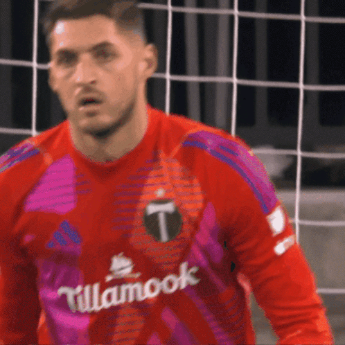A Soccer Player Wearing A Red And Purple Jersey With Tillamook Written On It GIF