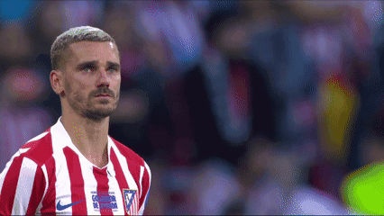 A Soccer Player Wearing A Red And White Striped Jersey With A Nike Logo On The Front GIF