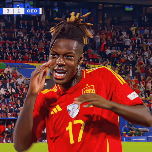 a soccer player wearing a red and yellow jersey with the number 17 on it