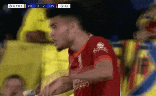 A Soccer Player Wearing A Red Jersey That Says Express GIF