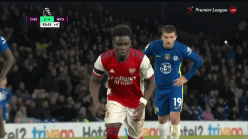 A Soccer Player Wearing A Red Jersey That Says Fly Emirates On It GIF