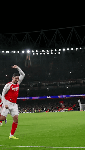 A Soccer Player Wearing A Red Jersey With Emirates Written On It Celebrates A Goal GIF